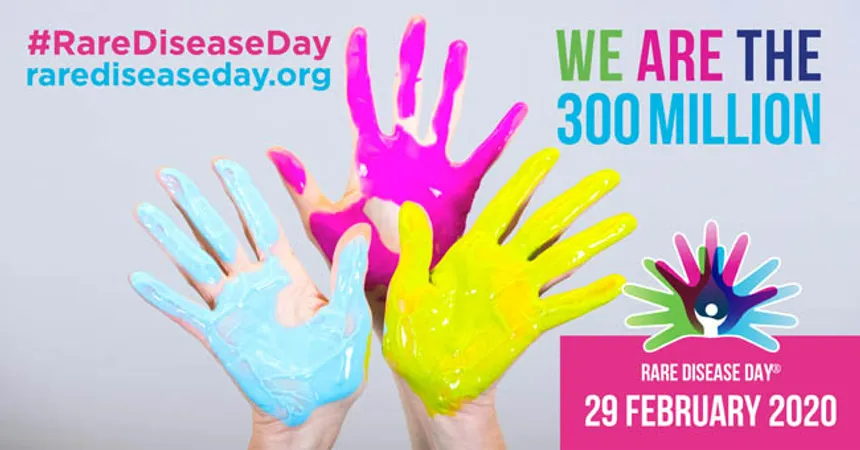 3 painted hands in blue, pink and yellow. Rare disease day 2020