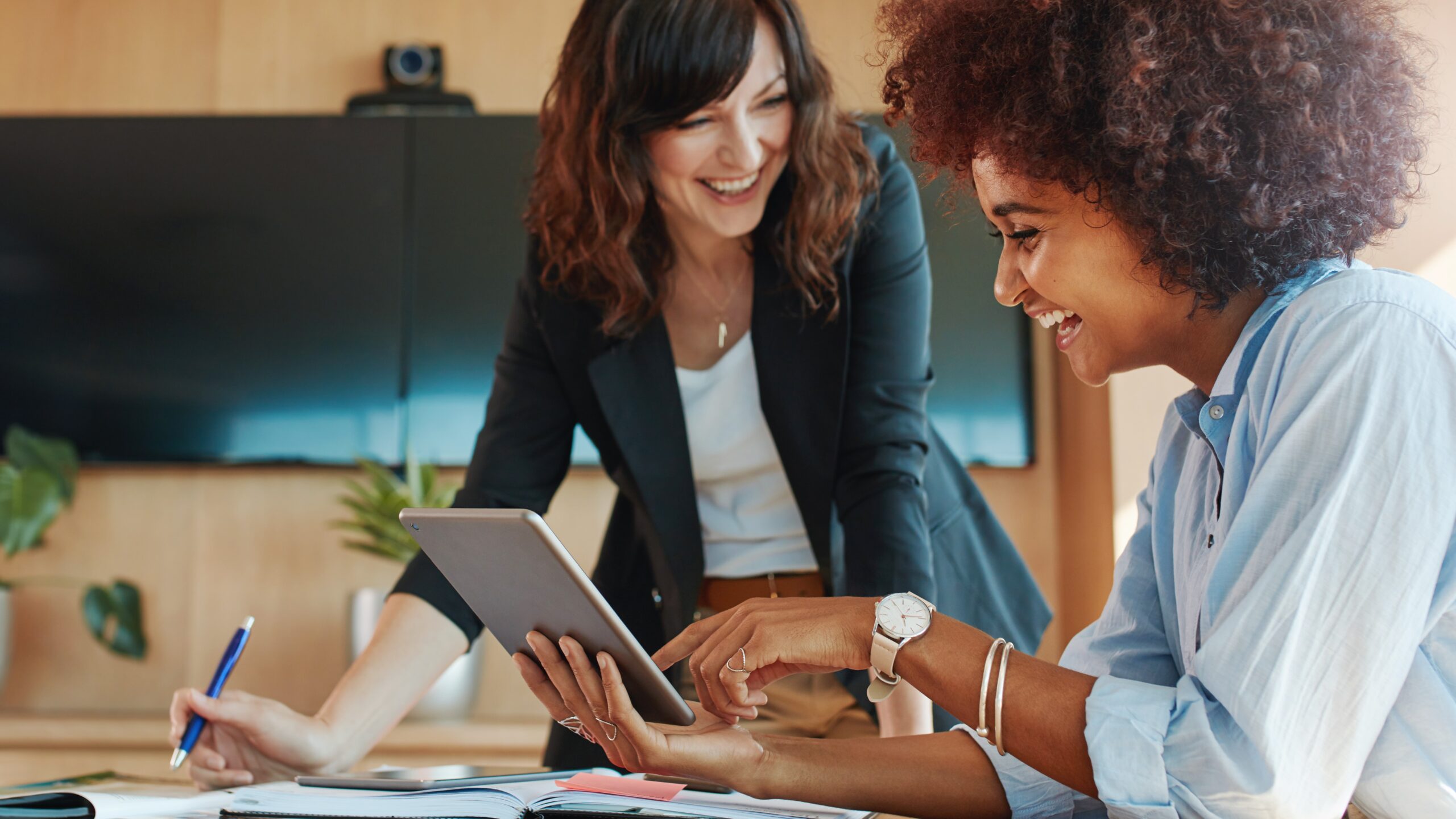 Creative female executives using digital tablet in office